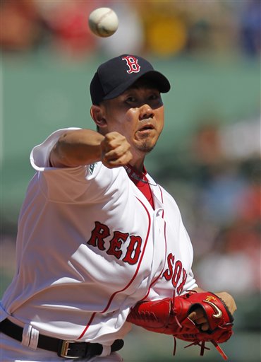 Boston Red Sox starting pitcher Daisuke Matsuzaka delivers a pitch against the Kansas City Royals in the first inning of a baseball game at Fenway Park, Monday.