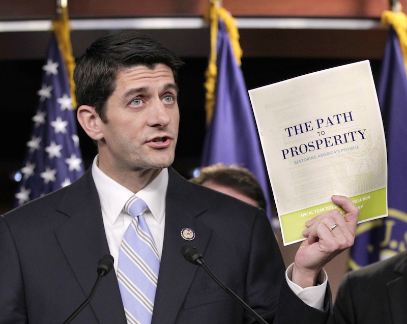 In this April 5, 2011 file photo, Republican Vice Presidential candidate, current House Budget Committee Chairman Rep. Paul Ryan, R-Wis., introduces his controversial "Path to Prosperity" budget recommendations, on Capitol Hill in Washington. Ryan was one of the harshest critics of President Barack Obama's economic stimulus plan, but months after Congress approved the nearly $800 billion package Ryan as a congressman was trying to steer money under the program to at least two companies in his home state of Wisconsin. (AP Photo/J. Scott Applewhite, File)