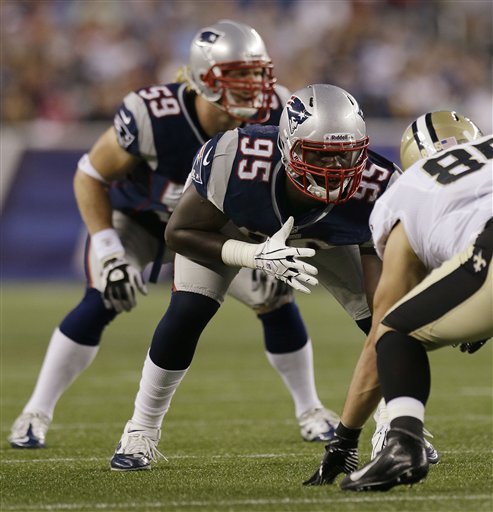 New England Patriots rookie defensive end Chandler Jones (95) lines up against New Orleans Saints tight end David Thomas (85) during their first NFL preseason football game against the New Orleans Saints in Foxborough, Mass., Thursday.