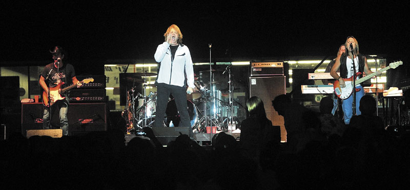 Eddie Money, center, performs at the Concourse in Waterville on Wednesday night.