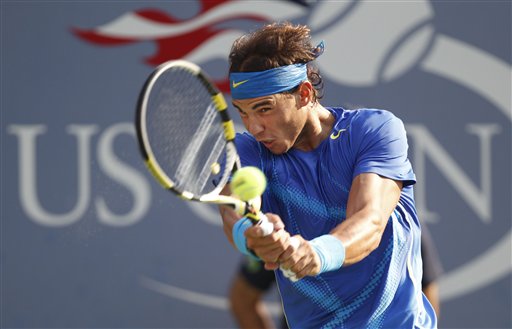 Rafael Nadal of Spain returns a shot to Novak Djokovic of Serbia during the men's championship match at the U.S. Open tennis tournament in New York in this Sept. 12, 2011, photo.