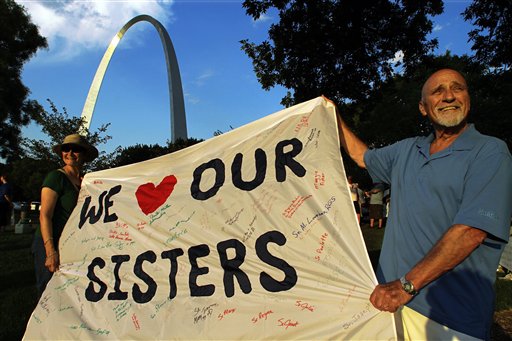 Joe Koerner and his wife Maria Allen Koerner, of St. Louis, rally with other supporters of The Leadership Conference of Women Religious (LCWR) at a vigil on Thursday in St. Louis.