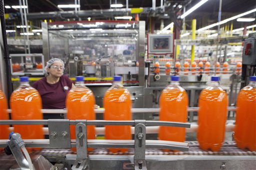 Bottles of Sunkist move down the line recently at the Dr Pepper Snapple bottling plant in Houston.