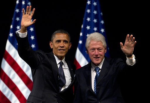 FILE - In this June 4, 2012 file photo, President Barack Obama and former President Bill Clinton wave to the crowd during a campaign event at the New Amsterdam Theater in New York. Clinton will have a marquee role in this summer's Democratic National Convention, where he will make a forceful case for Obama's re-election and his economic vision for the country, several Obama campaign and Democratic party officials said Sunday, July 29, 2012. (AP Photo/Carolyn Kaster, File)