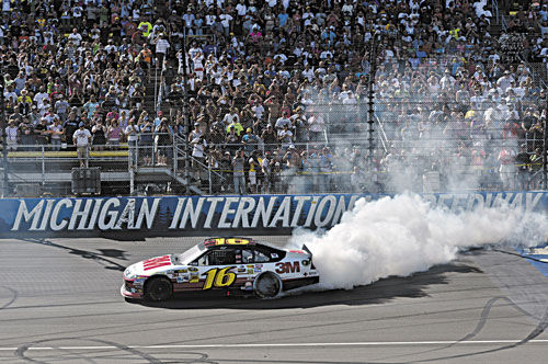 WINNER: Greg Biffle celebrates with a burnout after winning the NASCAR Sprint Cup Pure Michigan 400 at Michigan International Speedway on Sunday in Brooklyn Mich.