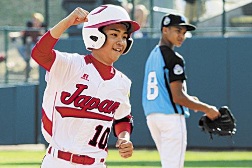 BIG HITTER: Japan’s Noriatsu Osaka rounds the bases past Goodlettsville, Tenn., second baseman Lorenzo Butler (8) after hitting a walk-off, two-run home run in the fifth inning of the Little League World Series championship game Sunday in South Williamsport, Pa. It was his third home run of the game.