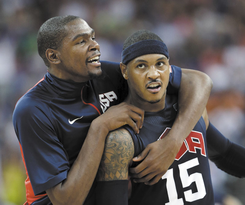 United States' Kevin Durant, left, celebrates with teammate Carmelo Anthony (15) after he scored during a semifinal men's basketball game against Argentina at the 2012 Summer Olympics, Friday in London. 2012 London Olympic Games Summe