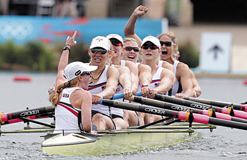 WE DID IT: U.S. rowers, front to back, Mary Whipple, Caryn Davies, Caroline Lind, Eleanor Logan, Meghan Musnicki, Taylor Ritzel, Esther Lofgren, Zsuzsanna Francia and Erin Cafaro celebrate after winning the gold medal for the women’s rowing eight Thursday in Eton Dorney, England at the 2012 Summer Olympics.