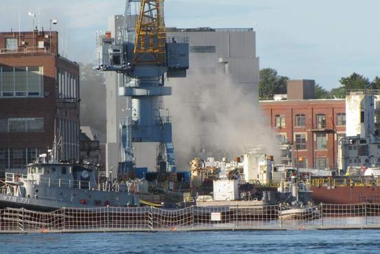 Smoke billows from the USS Miami, a nuclear submarine docked in Kittery, after a fire broke out in the sub's forward compartment on May 23.