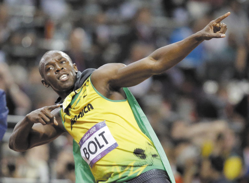 STILL THE MAN: Jamaica’s Usain Bolt celebrates after winning the gold medal in the men’s 100-meter final Sunday at the Olympic Stadium at the 2012 Summer Olympics in London. Bolt finished in an Olympic record time of 9.63 seconds. 2012 London Olympic Games Summe