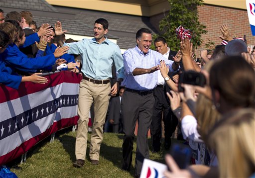 FILE - In this Aug. 25, 2012 file photo, Republican presidential candidate, former Massachusetts Gov. Mitt Romney and his vice presidential running mate Rep. Paul Ryan, R-Wis., arrive for a campaign rally in Powell, Ohio. They're the political world's newest odd couple: Mitt Romney and Paul Ryan are bound by substance, but dramatically different in style. The running mates share a love of policy, and a fascination with the world's economy and America's place in it. But where Romney is buttoned-up and reserved on the campaign trail, Ryan is relaxed and exudes a natural enthusiasm. (AP Photo/Evan Vucci, File)