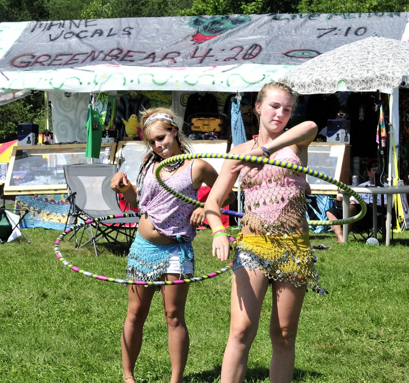 Kendall Emerton, left, and Jordan Rousse dance with hoops to live music during the Hempstock Fest in Harmony on Sunday. Organizer Don Christen said the 22nd festival of camping and music draws people interested in ending prohibition of marijuana. "The festival went well this year, though attendance was down from previous years," Christen said.