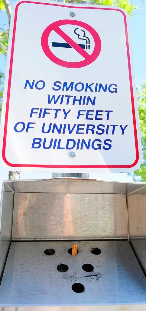Staff photo by Joe Phelan There are metal containers for cigarette butts outside buildings a the The University of Maine at Augusta. The University recently announced that it will go tobacco-free effective Jan. 1, 2013, joining the Orono and Farmington campuses.