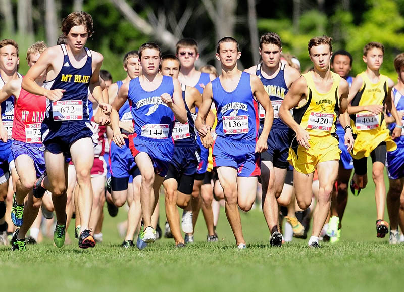 Mt. Blue's Justin Tracy, 672, left, was one of the early leaders as hundreds of runners take off at the start of the 2.4 mile course during the Scot Laliberte meet on Friday afternoon at Cony High School in Augusta.