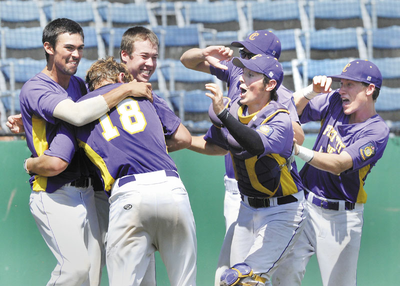 First Title's Harry Ridge, is mobbed by teammates after scoring the winning run in the bottom of the ninth inning as First Title beat Pastime 5-4 to win the American Legion Baseball state championship Monday at The Ballpark in Old Orchard Beach.