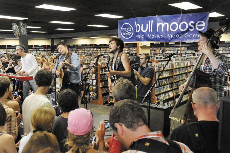 Mumford & Sons perform at Bullmoose Music in Scarborough on Friday, in preview to their Gentlemen of the Road show on Portland's Munjoy Hill today.