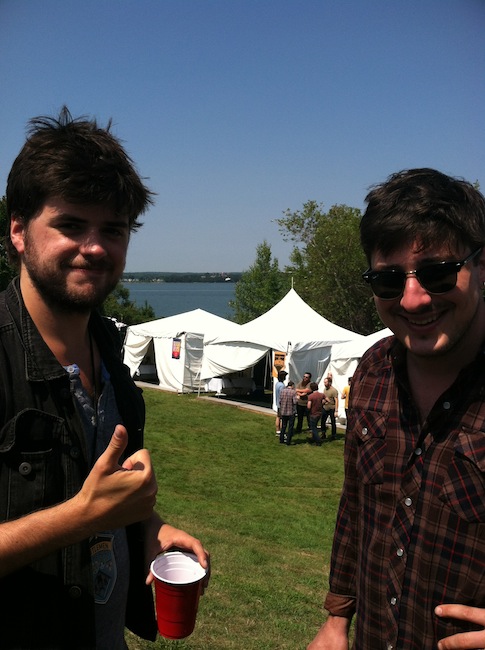 Winston Marshall and Marcus Mumford from Mumford & Sons hang out backstage on the Eastern Promenade at the "Gentlemen of the Road Stopover" music festival in Portland.