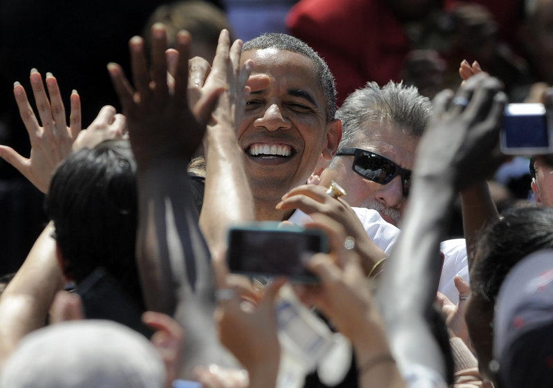 President Obama greets supporters during a rally Thursday at Colorado College in Colorado Springs, Colo.