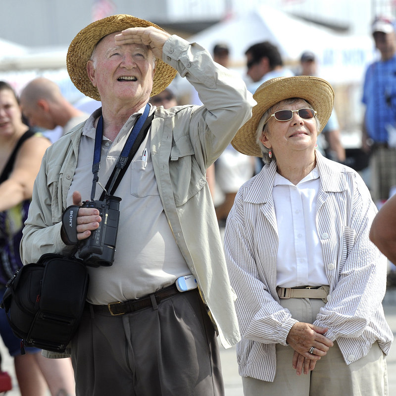 David and Martha Glass, from the Hancock County town of Sorrento, watch the performers at the Brunswick air show Saturday. Thousands of people turned out Friday and Saturday, and the event continues Sunday.