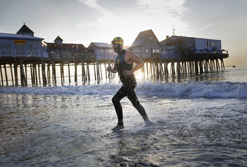 Vinny Johnson of North Berwick exits the water during the Revolution3 triathlon in Old Orchard Beach on Sunday.