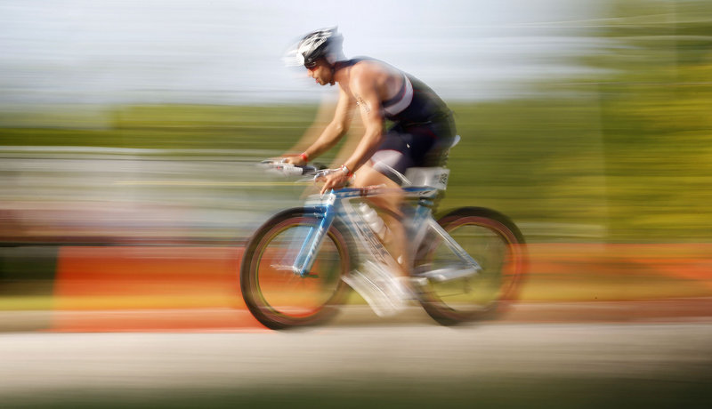 Robert Tafrate Jr. of New York, N.Y., cruises on Cascade Road during the Revolution3 triathlon in Old Orchard Beach on Sunday.