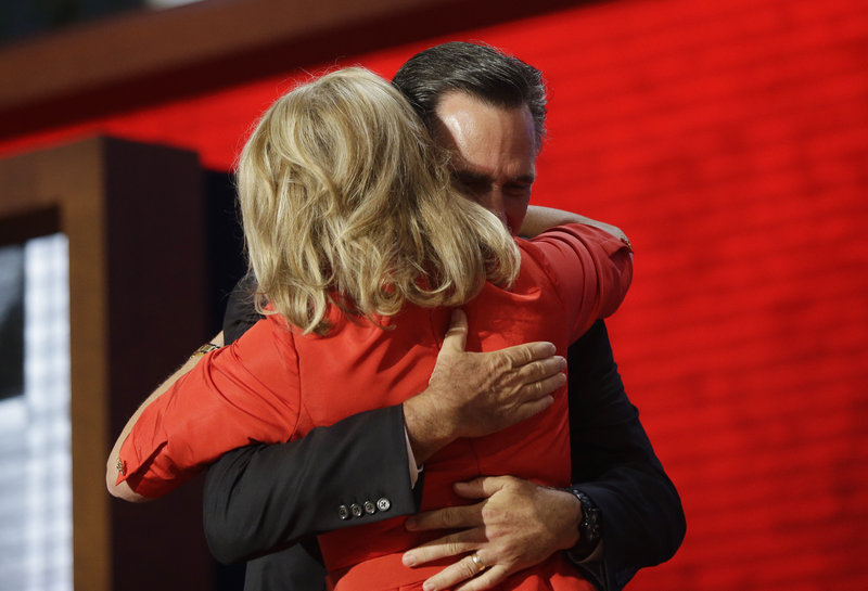 Republican presidential nominee Mitt Romney hugs his wife, Ann, on stage at the Republican National Convention in Tampa, Fla. on Tuesday following her prime-time speech.