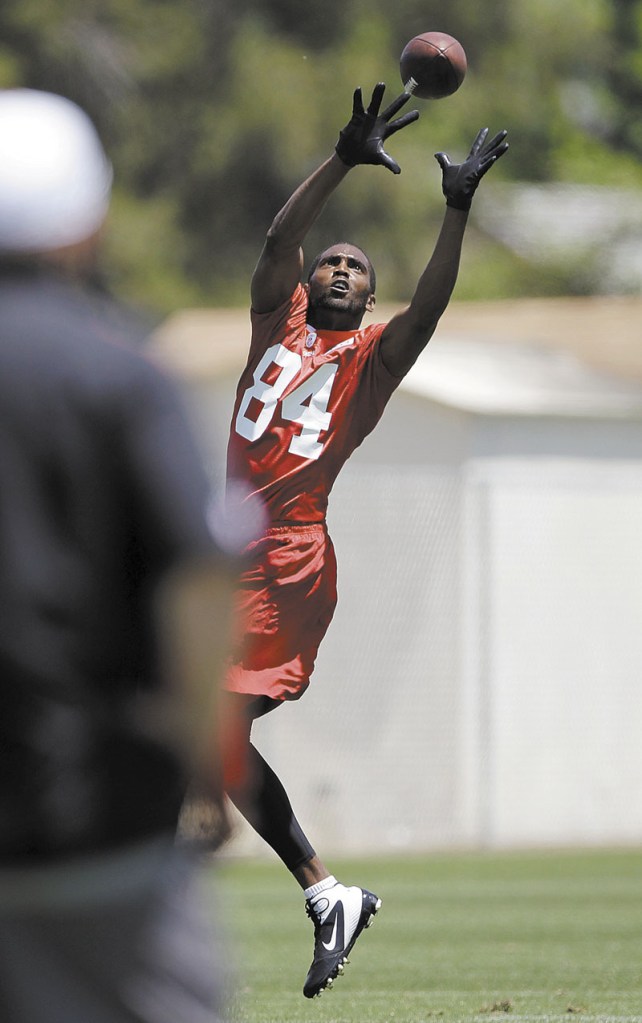 UP FOR GRABS: Randy Moss has looked good in training camp with the San Francisco 49ers despite taking last season off. The 35-year-old receiver is trying to make a comeback in the NFC West.