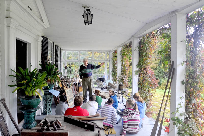 This 2009 file photo shows Gerry Mahoney presenting to Hall-Dale 6th graders with a history of shipbuilding and navigation on the Kennebec River Friday on the porch at the Vaughan Homestead in Hallowell. Students participating in the annual tour of the 18th century home and Vaughan Woods learned about geology, fish habitat and forest practices at the Homestead in addition to the history of the community.