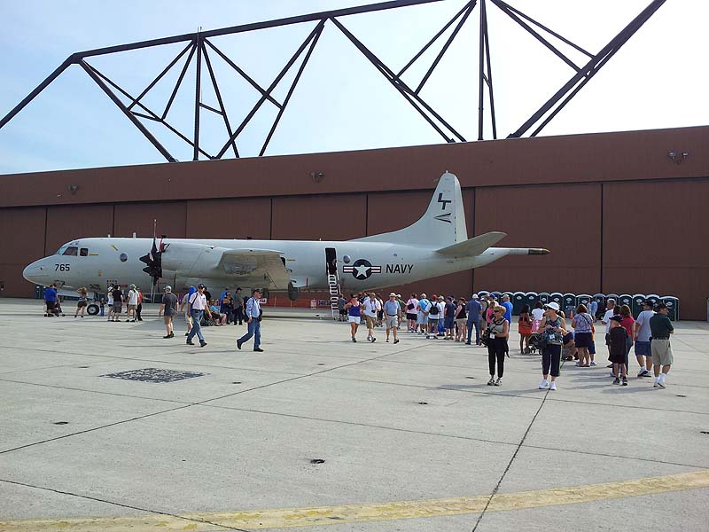 Air show visitors line up Saturday to tour a 28-year-old Navy P3 anti-submarine warfare aircraft, a version of the planes that were flown out of the former Brunswick Naval Air Station.