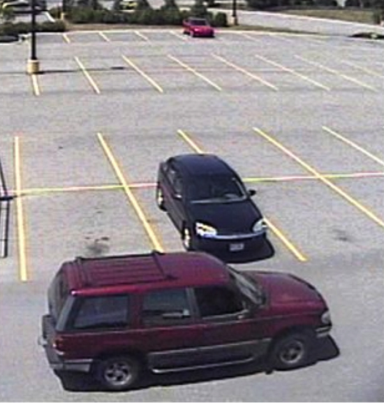 This surveillance image provided by Scarborough police shows the suspect leaving the Walmart parking lot in a maroon Ford Explorer.