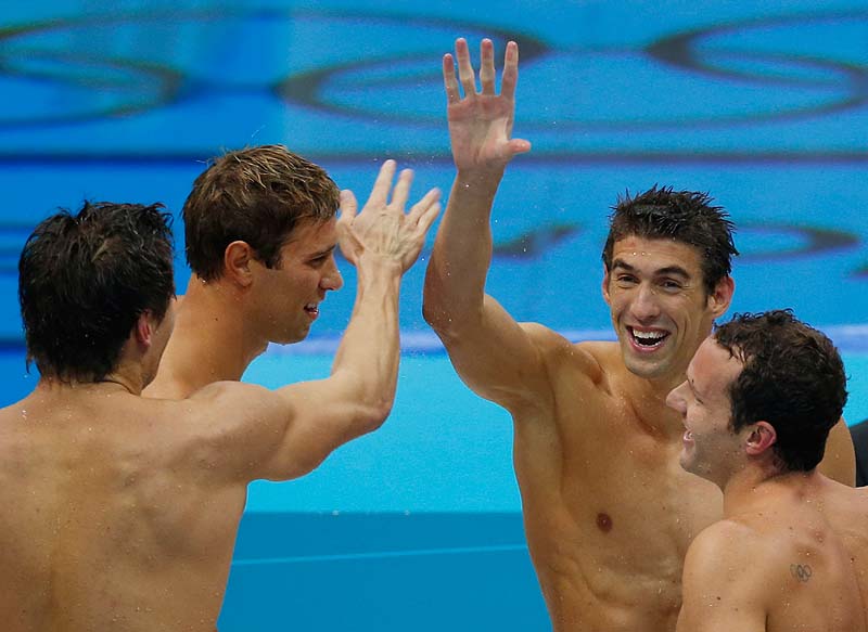 Michael Phelps celebrates with members of the gold-medal men's 4 X 100-meter medley relay team Saturday at the Olympics in London. 2012 London Olympic Games Summer Olympic games Olympic games Spo