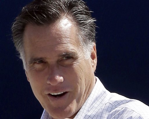 FILE - In this Sept. 23, 2012 file photo, Republican presidential candidate, former Massachusetts Gov. Mitt Romney gets ready to board his campaign plane in Los Angeles. Both presidential campaigns are trying to take advantage of an unusual Iowa law that gives their supporters a major say in determining where ballots can be cast before the election. Iowa�s law allows anyone who gets the signatures of 100 county voters to choose a specific voting place in that county. Before early voting begins Thursday, volunteers for both campaigns turned in a batch of petitions last week calling for voting at locations most convenient to their voters. (AP Photo/Charles Dharapak, File)