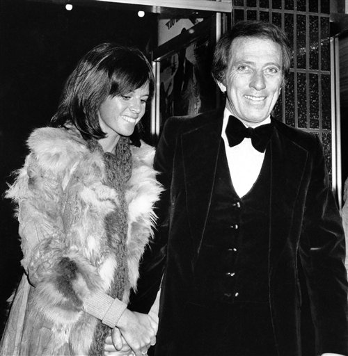 FILE - In a Dec. 19, 1974 file photo, American singer Andy Williams and his wife Claudine Longet, shown upon arrival at the Odeon, Leicester Square, London, for the Royal Charity World premiere of "The Man With the Golden Gun." Emmy-winning TV host and "Moon River" crooner Williams died Tuesday night, Sept, 25, 2012 at his home in Branson, Mo., following a year-long battle with bladder cancer. He was 84. (AP Photo/Press Association, File)