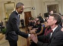 FILE - In this Feb. 7, 2012, file photo, President Barack Obama shakes hands with Bill Nye during an event in the East Room of the White House in Washington. Nye, a mechanical engineer and star of the popular 1990s Television show �Bill Nye The Science Guy,� recently waded into the evolution debate with an online video urging parents not to pass their religious-based doubts about evolution on to their children. (AP Photo/Susan Walsh, File)