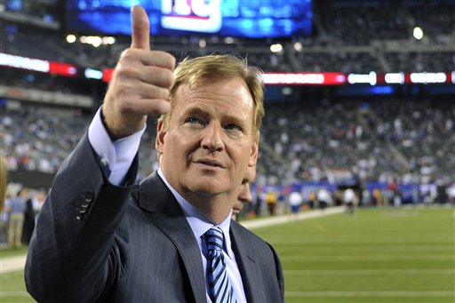 FILE - In this Sept. 5, 2012, file photo, Commissioner Roger Goodell gestures to fans before an NFL football game between the New York Giants and the Dallas Cowboys in East Rutherford, N.J. The NFL and referees' union reached a tentative agreement on Wednesday, Sept. 26, to end a three-month lockout that triggered a wave of frustration and anger over replacement officials and threatened to disrupt the rest of the season. (AP Photo/Bill Kostroun, File)