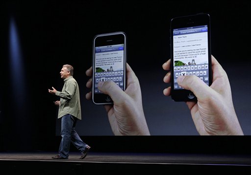 Phil Schiller, Apple's senior vice president of worldwide marketing, speaks on stage during an introduction of the new iPhone 5 at an Apple event in San Francisco on Wednesday.