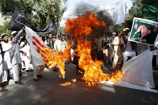 Afghan university students burn a U.S. flag in Nangarhar province, east of Kabul on Wednesday in a protest against the U.S.-produced, anti-Islam film "Innocence of Muslims."