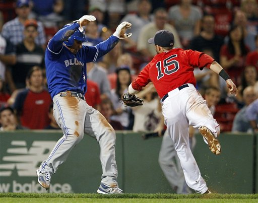 Boston Red Sox's Dustin Pedroia (15) tags out Toronto Blue Jays' Anthony Gose left, in a run down in the ninth inning of a baseball game in Boston, Friday, Sept. 7, 2012. (AP Photo/Michael Dwyer)