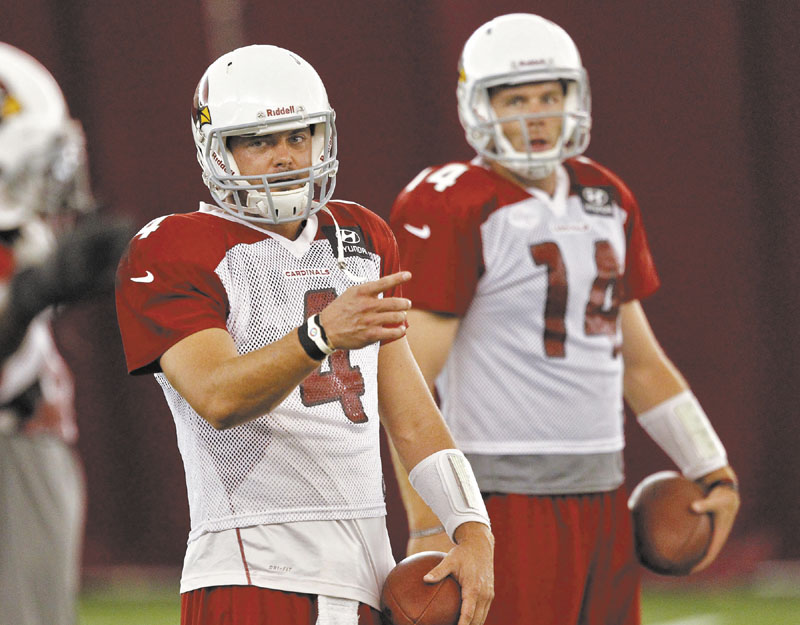 WHO WILL IT BE?: Arizona Cardinals quarterbacks Kevin Kolb (4) and Ryan Lindley run drills during practice Thursday at Arizona State University in Tempe, Ariz. The Cardinals have not announced who will start at quarterback against the New England Patriots on Sunday.