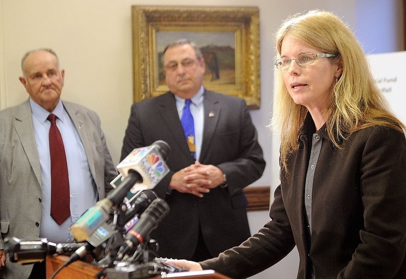 Mary Mayhew, the commissioner of the Department of Health & Human Services, right, said during a news conference last year that her team had been analyzing Medicaid numbers for months. Shown at left are H. Sawin Millett Jr., the commissioner of Administrative & Financial Services, and Gov. Paul LePage.