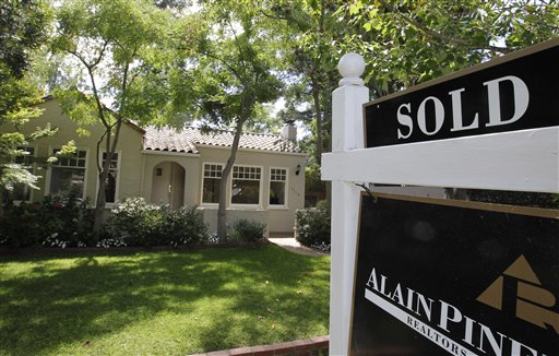 A sold sign is posted outside a home in Palo Alto, Calif., recently. More Americans appear to be taking advantage of near-record low mortgage rates and prices that are, on average, much lower than they were six years ago.