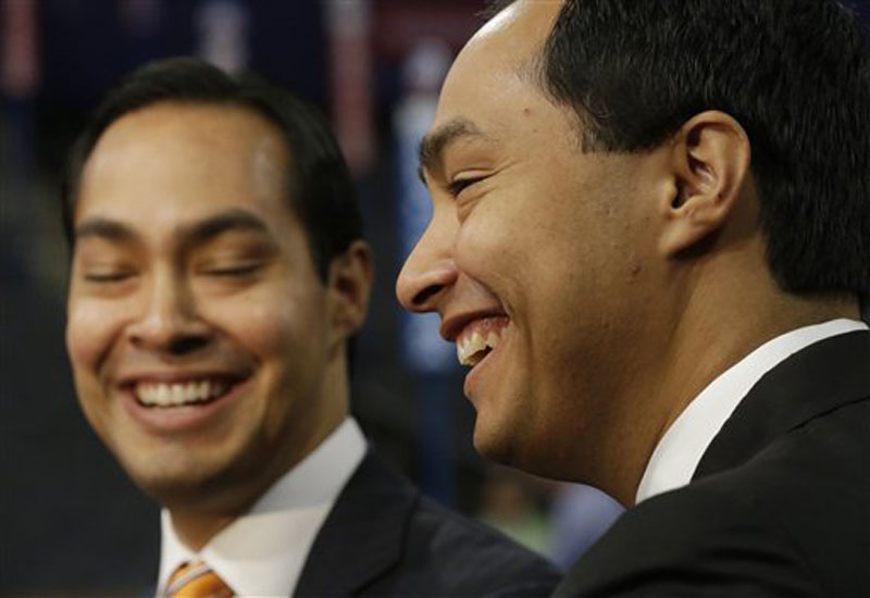 San Antonio Mayor Julian Castro, left, who will be the convention keynote speaker, and his twin brother, State Representative Joaquin Castro, who is running for U.S. Congress, are interviewed at the Democratic National Convention in Charlotte, N.C., Monday, Sept. 3, 2012. (AP Photo/Charles Dharapak)