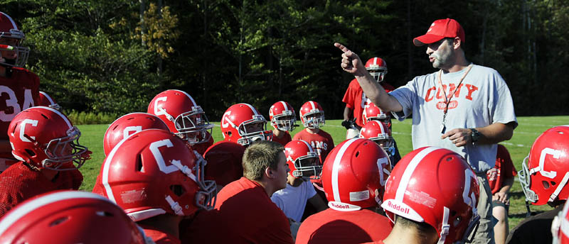 Staff photo by Andy Molloy TALKING ABOUT WINNING: Cony Football coach Rob Vachon speaks with his team Tuesday during practice in Augusta. The Rams are 3-1 in and in the midst of their first three-game winning streak since 2007.