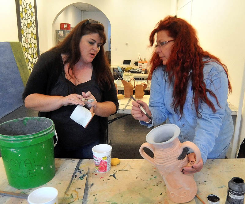 Tracey Steuber, right, receives pottery instruction from art teacher Kimberly Bently, left, Tuesday during Open Studio at Common Street Arts in Waterville. Open Studio happens every Tuesday from 5 to 8 p.m. and costs $10 per student.