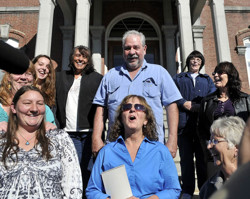 Staff photo by Michael G. Seamans Christine Belangia, of Weld, celebrates with friends and family on the steps of Somerset County Superior Court after Jay Mercier was found guilty for the murder of her sister Rita St. Peterat in Skowhegan this week.