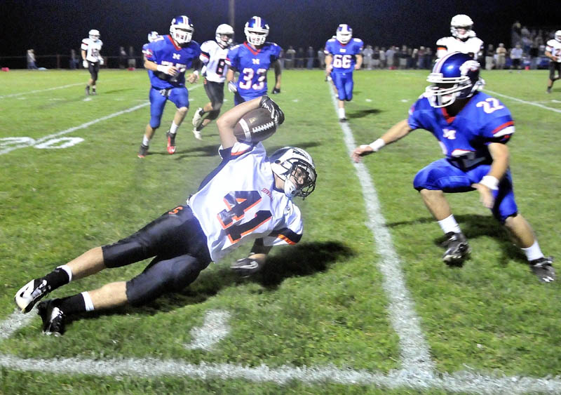 Skowhegan High School's Kaleb Brown, 41, dives for extra yards on a kick-off return in the second quarter at Messalonskee High School in Oakland Friday night.
