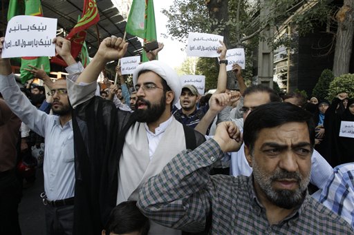 Iranian protestors chant slogans during a demonstration against a film ridiculing Islam's Prophet Muhammad, in front of Swiss Embassy in Tehran, which represents US interests in Iran on Thursday. The Associated Press photo