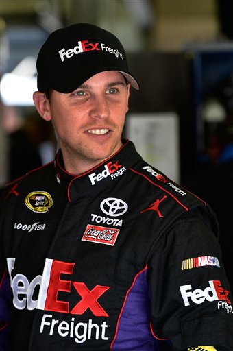 Denny Hamlin stands in the garage area during practice for the NASCAR Sprint Cup Series auto race at New Hampshire Motor Speedway, Friday, Sept. 21, 2012, in Loudon, N.H. (AP Photo/Autostock, Brian Czobat) 2012;Sylvania 300;NASCAR;Practice;New Hampshire Motor Speedway;September;Sprint Cup Series;Loudon;New Hampshire;Autostock;Chase
