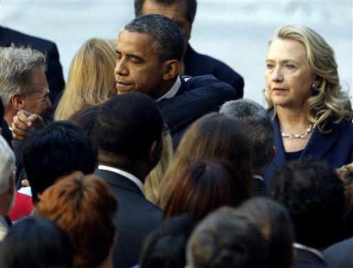 President Barack Obama, accompanied by Secretary of State Hillary Rodham Clinton, meets with State Department personnel in the courtyard of the State Department in Washington on Wednesday after speaking at the White House concerning the recent deaths of Americans in Libya.