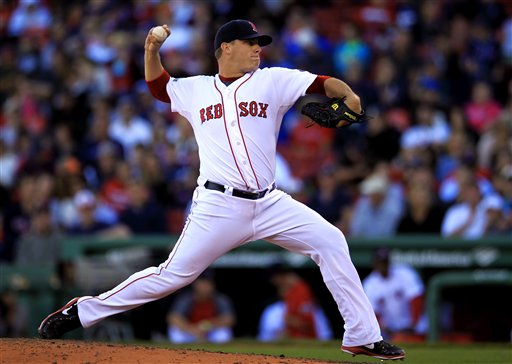 Boston Red Sox relief pitcher Andrew Bailey winds up for a pitch against the Baltimore Orioles in the ninth inning of a baseball game at Fenway Park, in Boston, Sunday, Sept. 23, 2012. (AP Photo/Steven Senne)